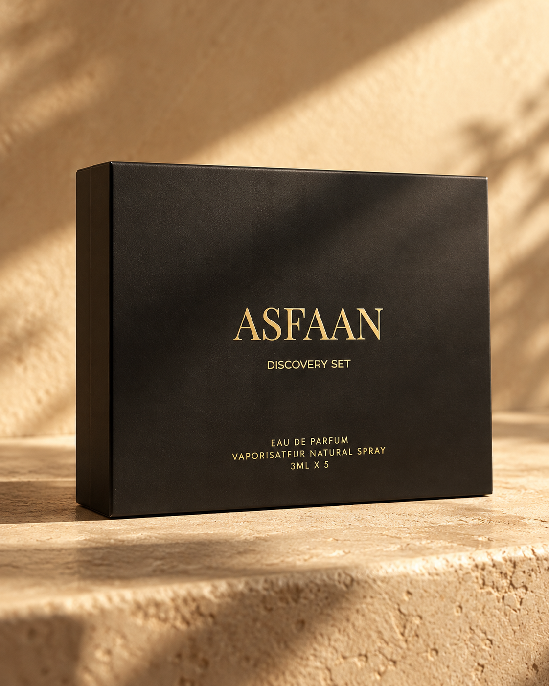 ASFAAN Discovery Set closed matte black sliding sleeve with gold lettering in warm natural light